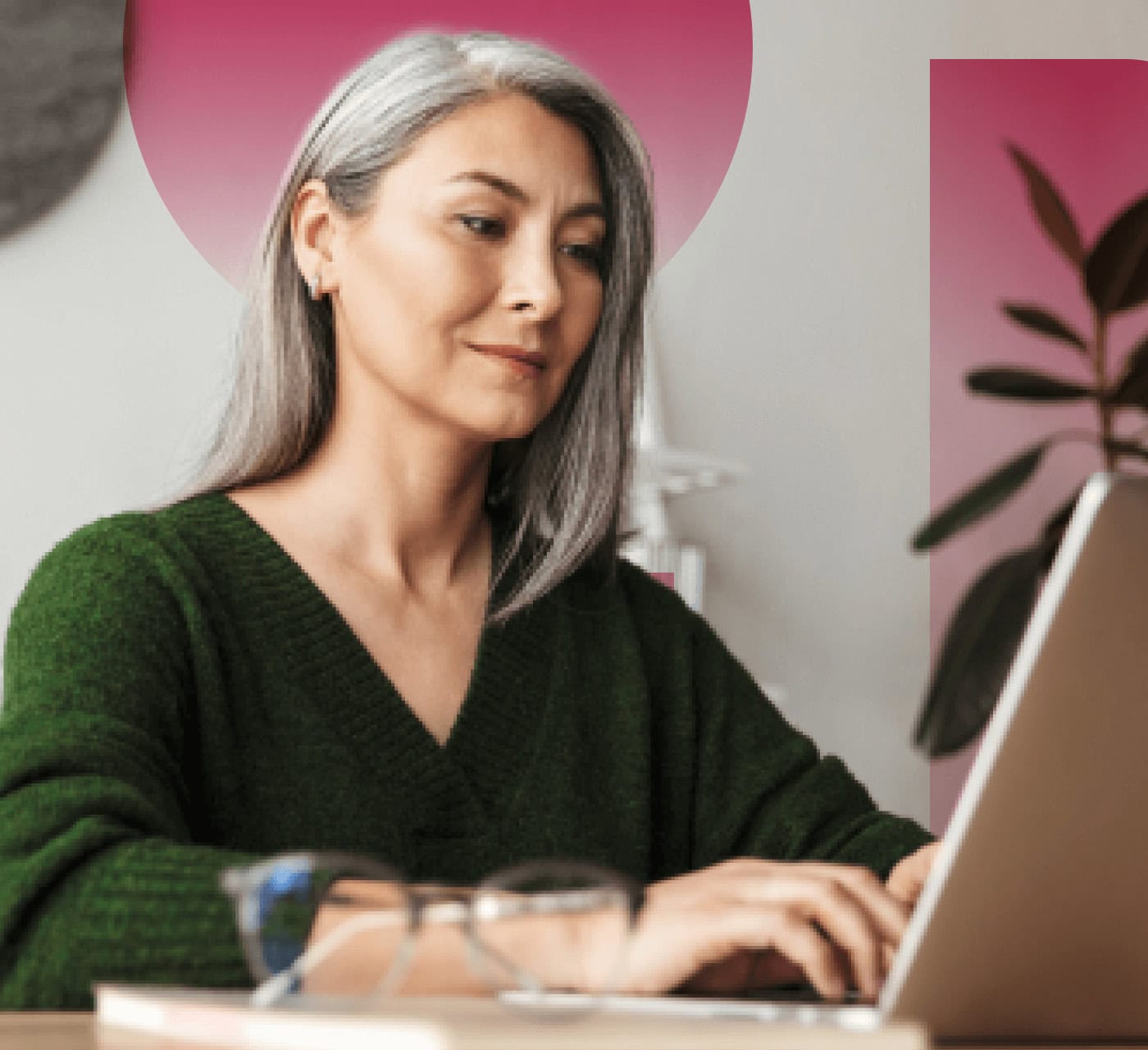A digital asset manager reviewing the digital asset management system on her laptop