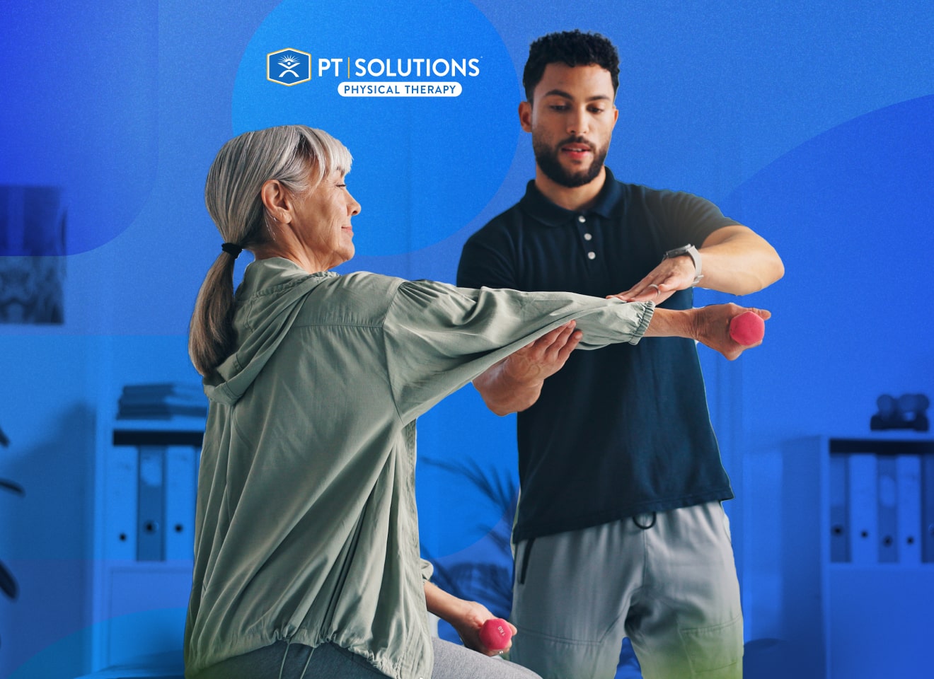 Male physio helping a girl with an arm injury at PT Solutions