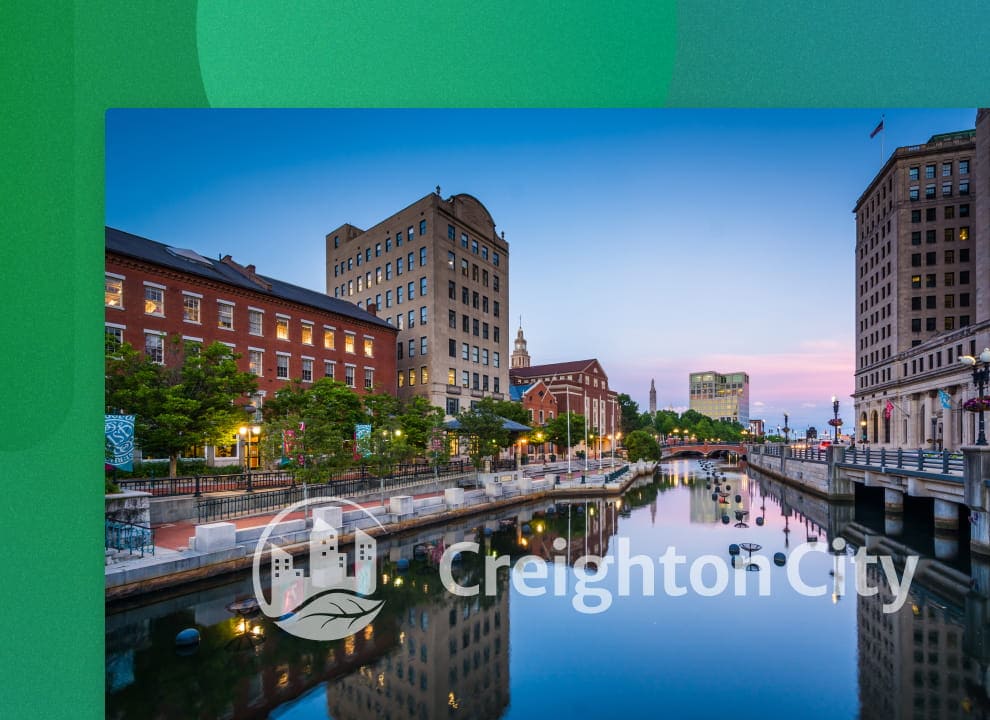 City with a canal at dusk, with a watermark over the image