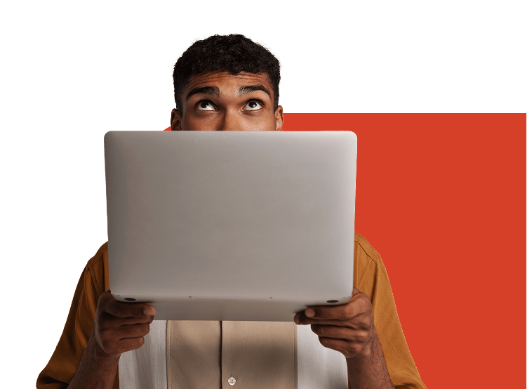 Man with laptop looking up