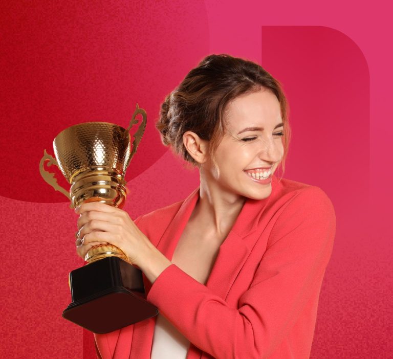 woman in a magenta jacket holding a trophy celebrating on a magenta background