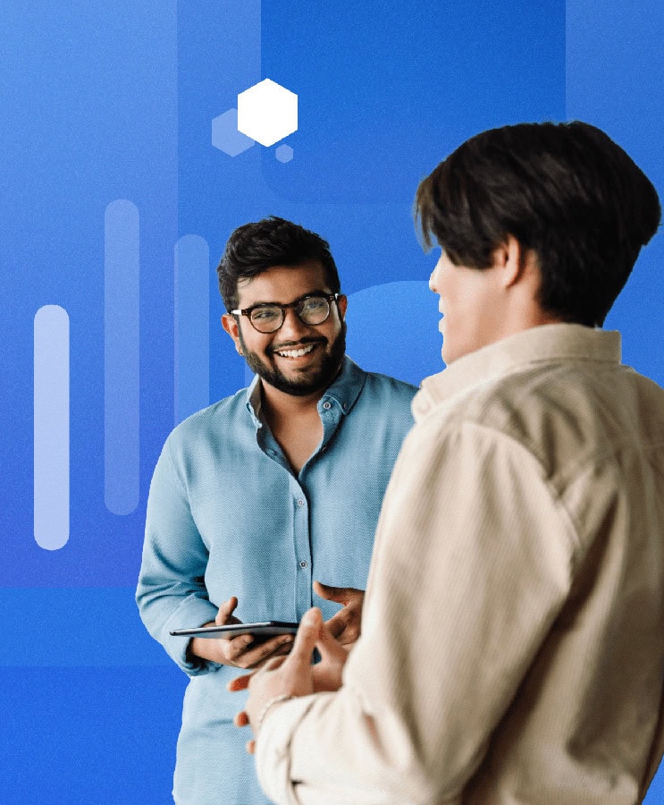 Smiling business man and woman holding an ipad