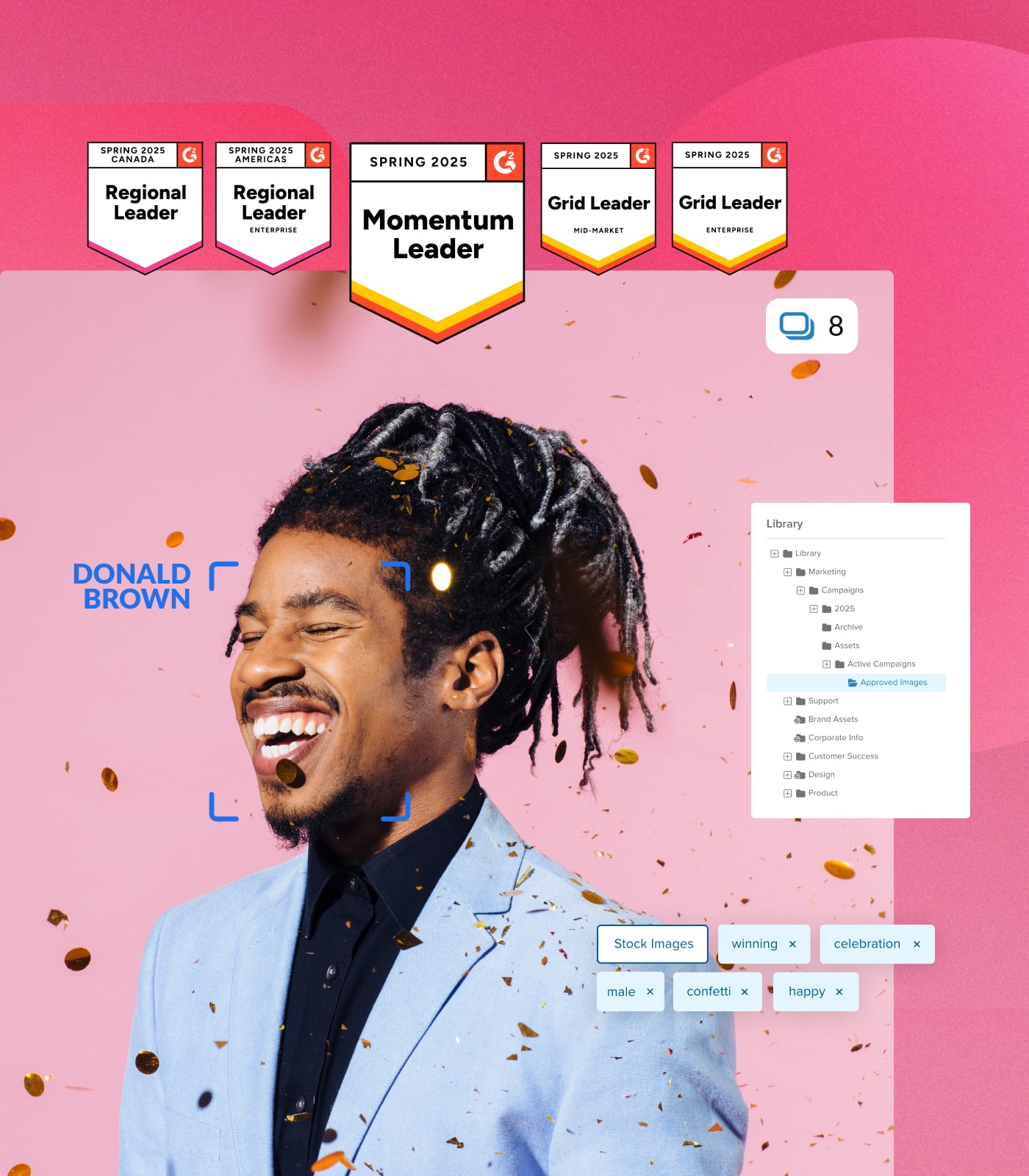 Smiling man in a light blue blazer with confetti falling around him, labeled as Donald Brown. Above are Spring 2025 G2 award badges, with a digital asset library and tags like 'celebration' and 'happy' on the right.
