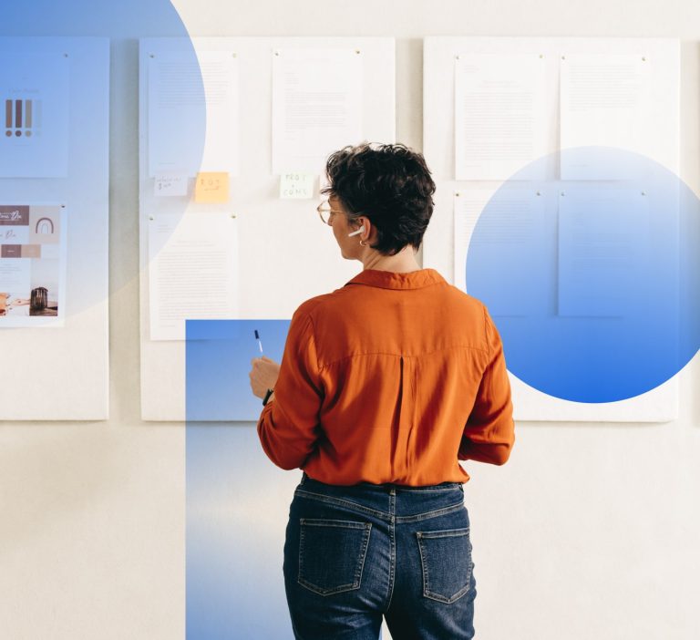 Person looking at different charts to understand BAM vs DAM differences
