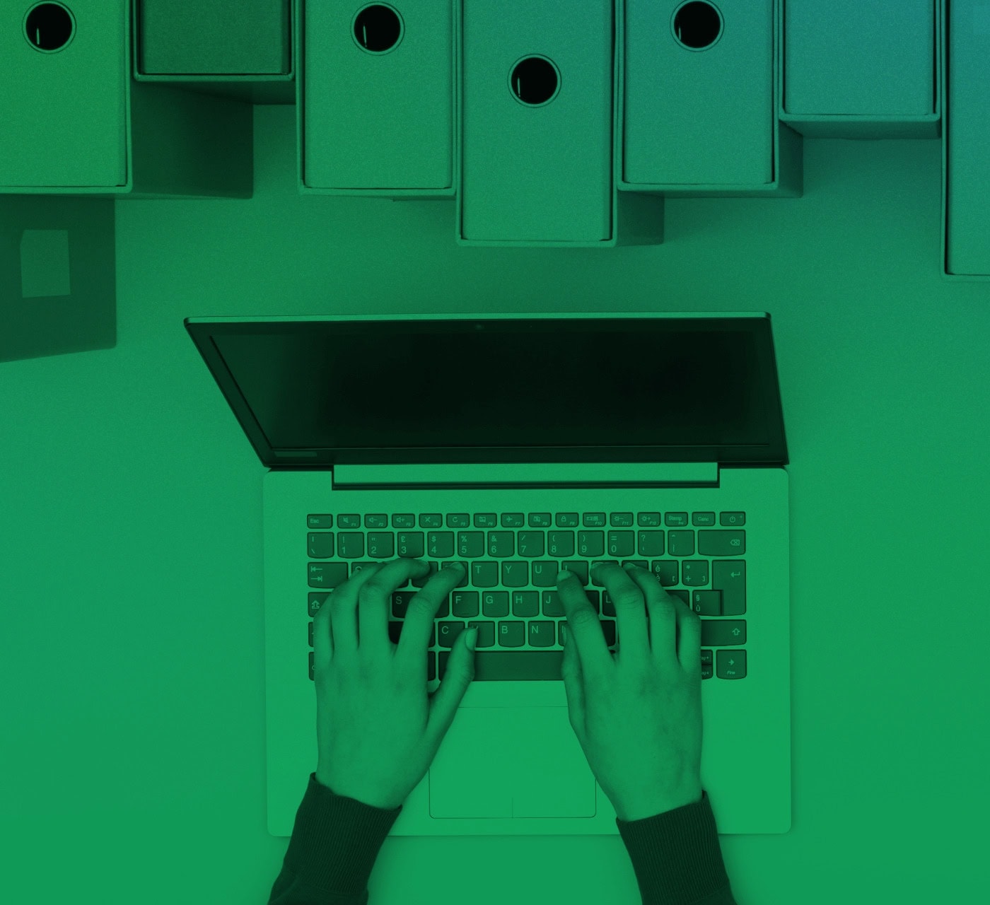 green image aerial view of hands on a laptop