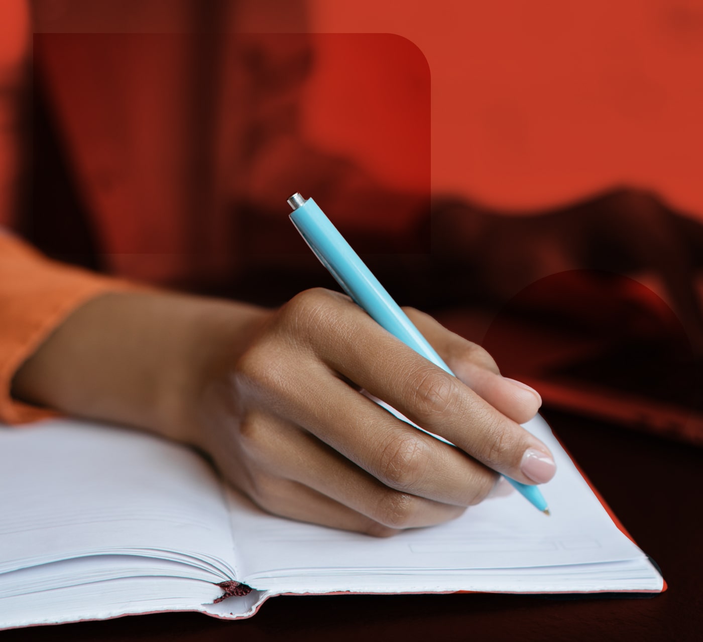 Hand writing notes about content proofing into a notebook