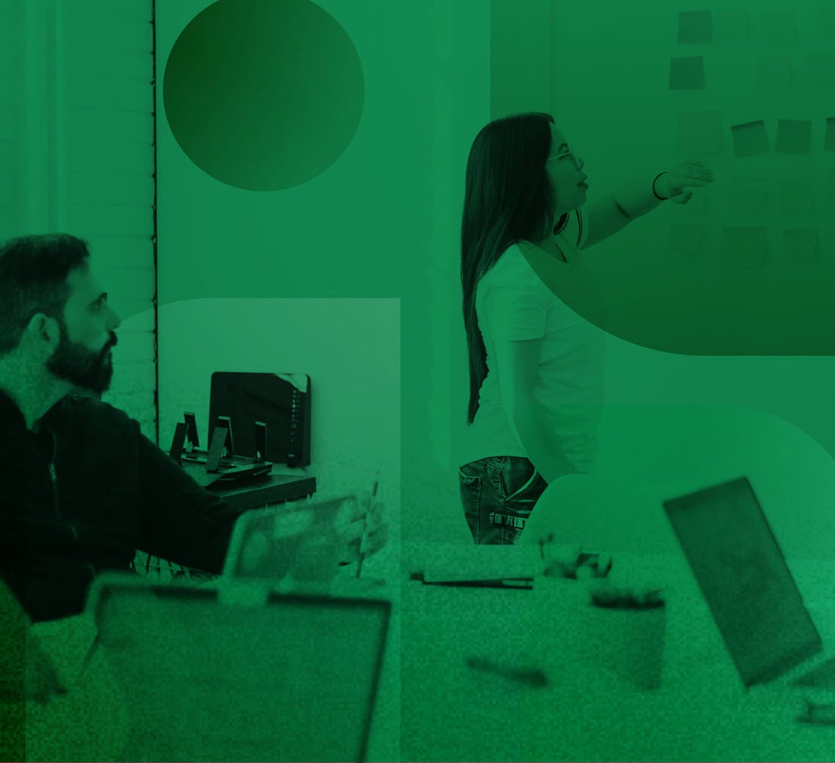 Man and woman collaborating in a conference room