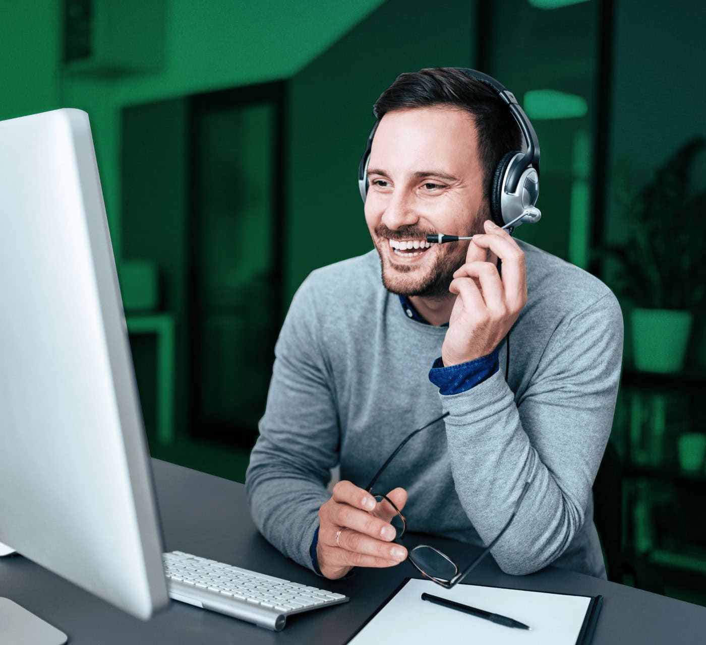 Smiling businessman working on a laptop